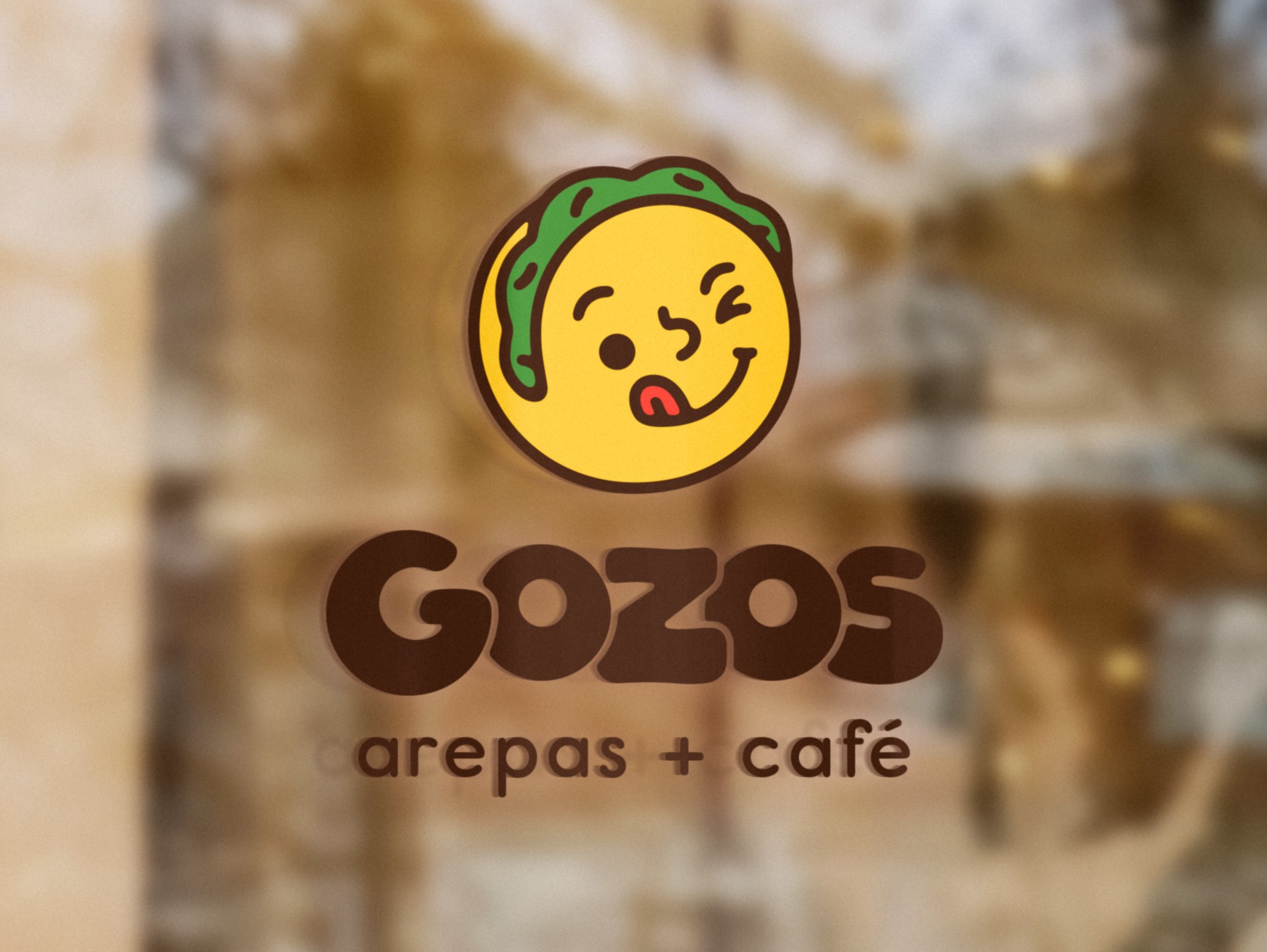 The Gozos lockup on the shop window, the room behind it out of focus