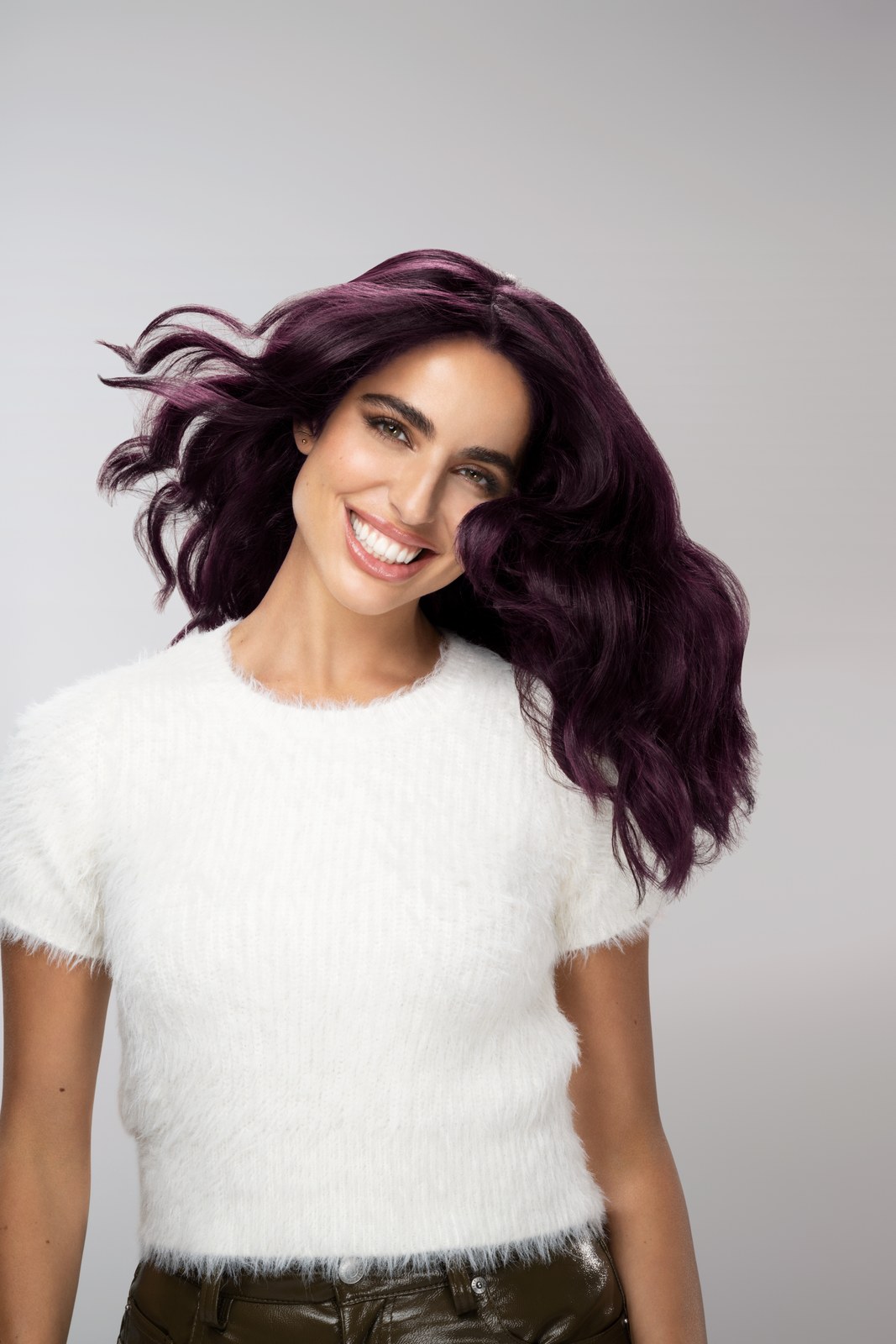 Model with violet Keratin Color hair in a fluffy white top