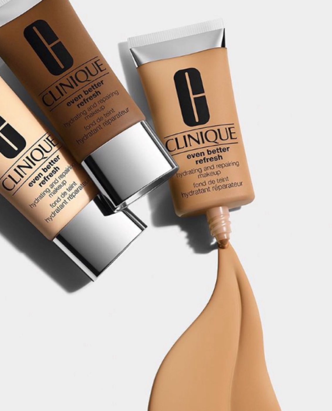 Two Clinique Even Better foundation tubes with a pour of foundation